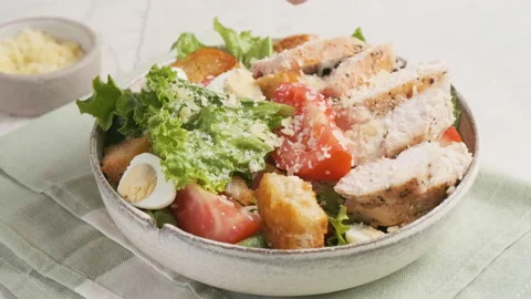 Eating Caesar salad with fork. Healthy salad made of chicken fillet, lettuce Stock Footage 251017954