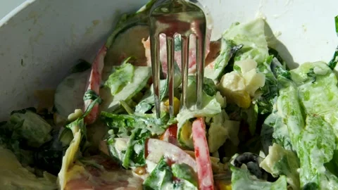 Eating Caesar salad with fork. Healthy salad made of chicken fillet, lettuce Stock Footage 318583864
