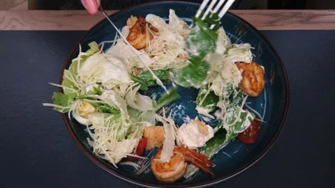 Eating caesar salad with parmesan cheese and chicken. Stock Footage 155270515