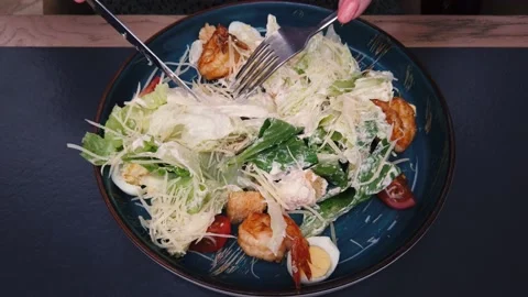 Eating caesar salad with parmesan cheese and chicken. Stock Footage 158333204