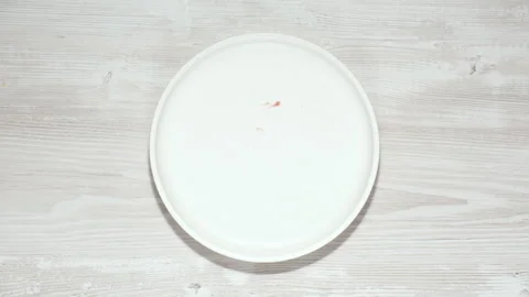 Eating cake bite by bite, stop motion. Plate of cake moving in the frame Stock Footage 275803252