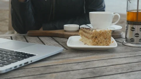 Eating cake at working time in a cafe Stock Footage 124578492