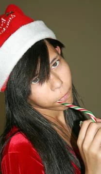 Eating Candy Cane Stock Photos