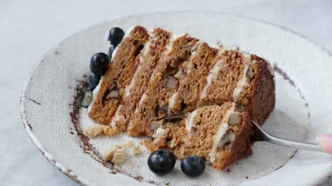 Eating carrot cake with fork Stock Footage 155275744