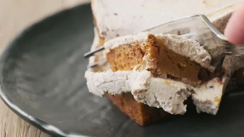 Eating Carrot Cake. Taking bite of healthy vegan cake. Stock-Footage 152480375