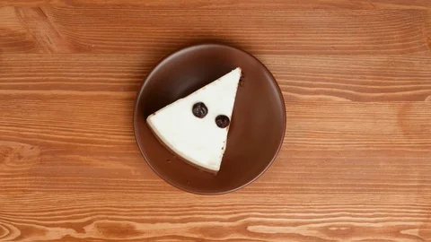 Eating cheesecake with chocolate drops. Stock Footage 73496476