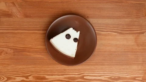 Eating cheesecake with chocolate drops. Stock Footage 73496510