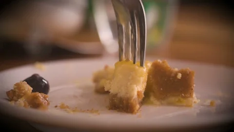 Eating cheesecake from a plate Stock Footage 90159345