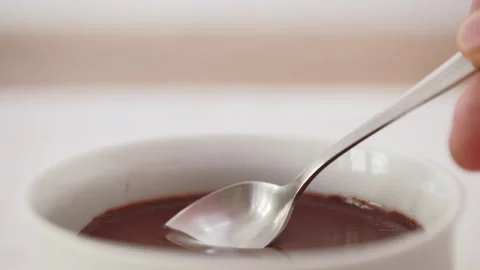 Eating chocolate pudding with spoon Stock Footage 243547438