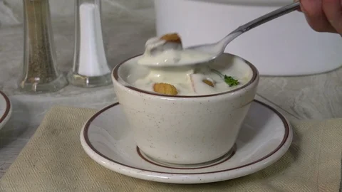 Eating clam chowder slow motion Stock Footage 94689843