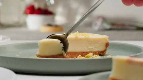 Eating classic dessert cheesecake by spoon close-up macro. Cheesecake is a Stock Footage 278921174