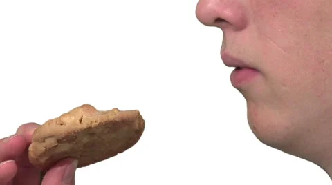 Eating a cookie, white background Stock Footage 49862488