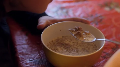 Eating cornflakes. Everydayness. Stock Footage 102564882