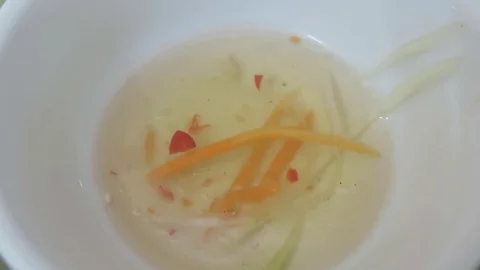 Eating cucumber with sauce in bowl Stock Footage 70375341