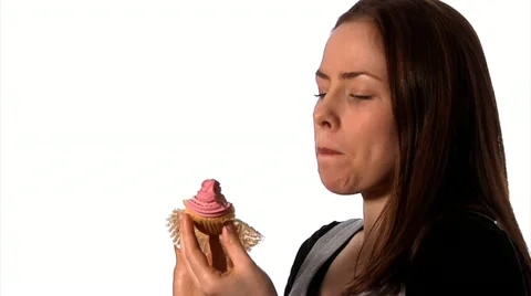 Eating a cupcake Stock Footage 22637085