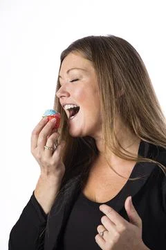 Eating cupcake Stock Photos