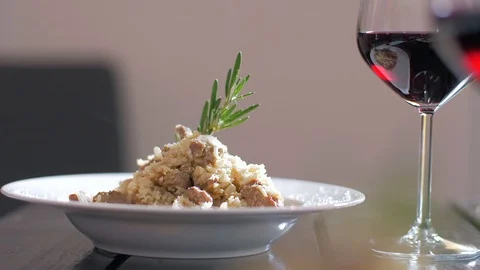 Eating delicious Risotto with veal fillet. Stock Footage 106935314
