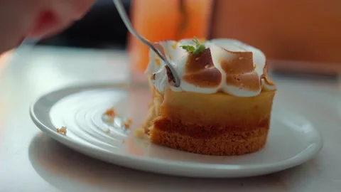 Eating dessert with fork. Close up slow motion of taking piece of dessert with Stock Footage 204997934