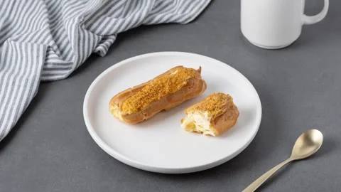 Eating eclairs. Stop motion animation. Stock Footage 338203093