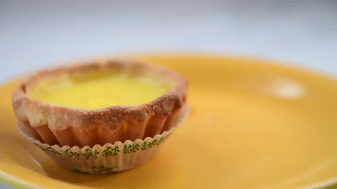 Eating an egg tart Stock Footage 153528225