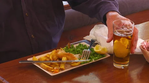 Eating fish and chips lunch Stock Footage 48548548