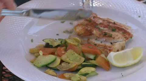 Eating fish a a Bistro (1 of 3) Stock Footage 8981629