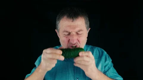 Eating fresh cucumber Stock Footage 169296781