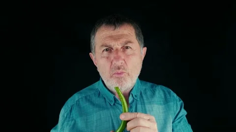 Eating fresh green pepper Stock Footage 169296935