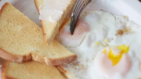 Eating fried eggs Stock Footage 75427155