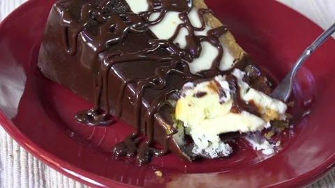 Eating gourmet cheesecake Stock Footage