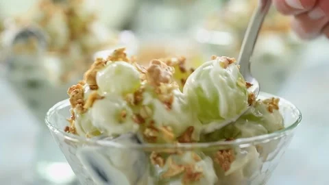Eating of grape salad with yogurt. Stock Footage 170903092