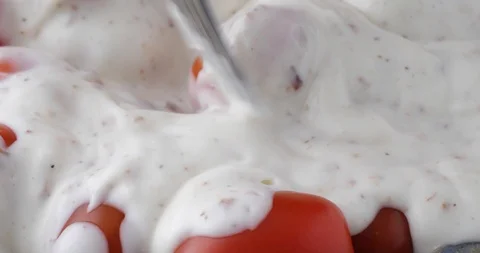 Eating grape tomatoes covered with ranch dressing Stock Footage 87660211