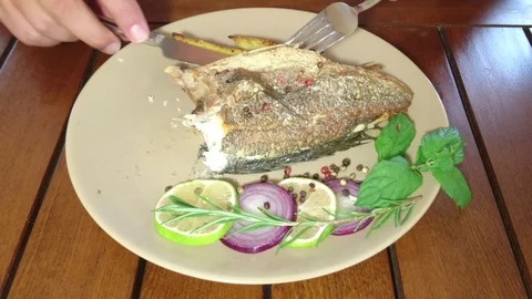 Eating Grilled Fish Stock Footage 92112499
