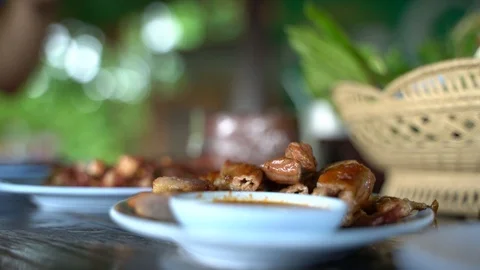Eating grilled intestine Stock Footage 117330101