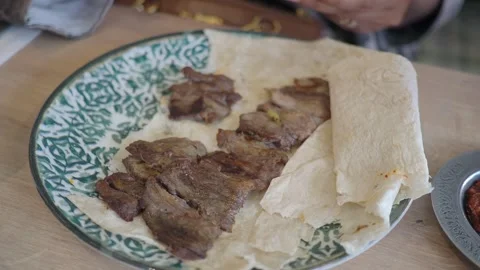 Eating grilled meat with bread in a restaurant Stock Footage 342304250