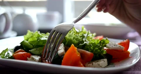 Eating a healthy salad from fresh vegetables Stock Footage