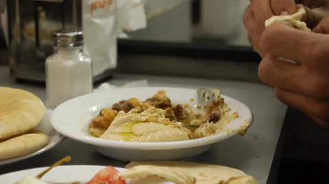 Eating a hummus Dish 0411 Stockbeeldmateriaal 33755033