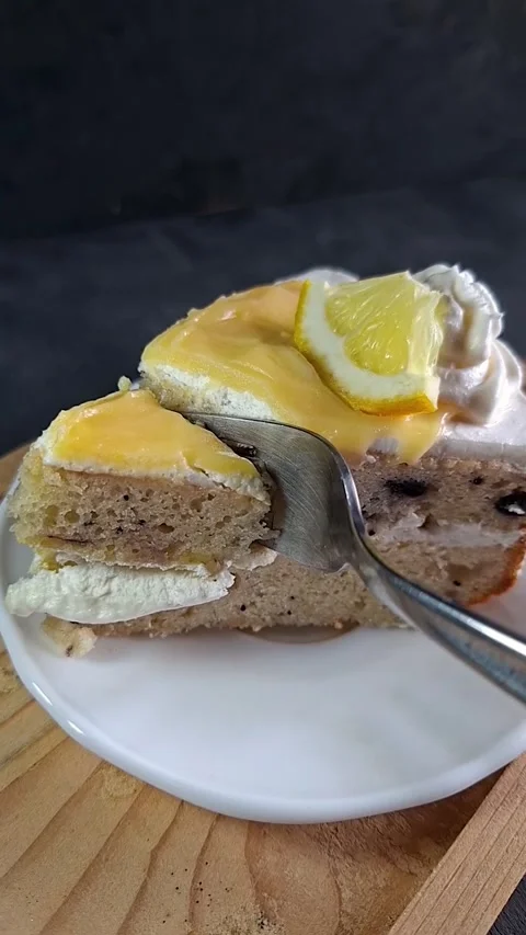 Eating Lemon Raspberry Cake. Taking a Bite of Cake with Fork Stock Footage 337192828