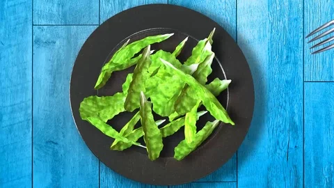 Eating lettuce on a plate Stock Footage 71295307
