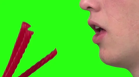 Eating licorice, green background Video stock 49862618