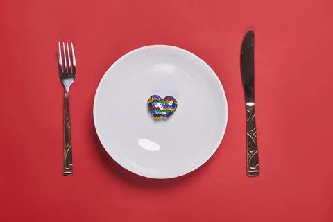 Eating love. Heart shape balloon eating Stock Photos