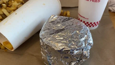 Eating a meal at Five Guys Stock Footage 174294925