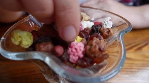 Eating Nuts and Dried Fruit Stock Footage 65392021