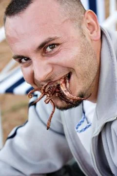 Eating the octopus Stock Photos