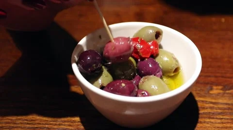 Eating olives in restaurant Video stock 48220623