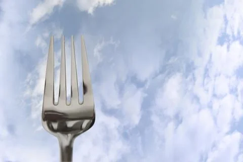 Eating out fork isolated in clouds Stock Photos