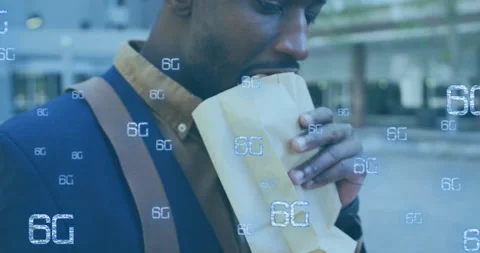 Eating from paper bag, man surrounded by 6G technology animation Stock Footage 304404710