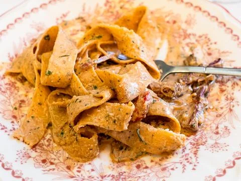 Eating pappardelle pasta with pulled beef Stock Photos