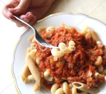 Eating pasta with fork Stock Photos