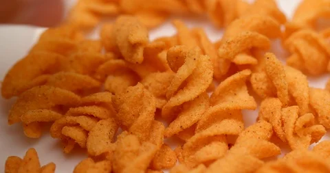 Eating pea cracker Stock Footage 87601188